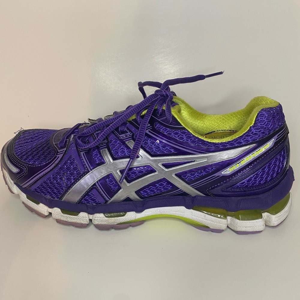 ASICS sneakers purple white and neon green.